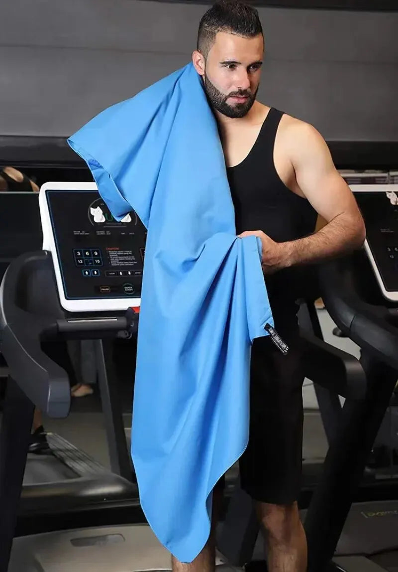 Quick-drying sports towel in blue, grey, green, and orange for gym, swimming, fitness, and outdoor activities