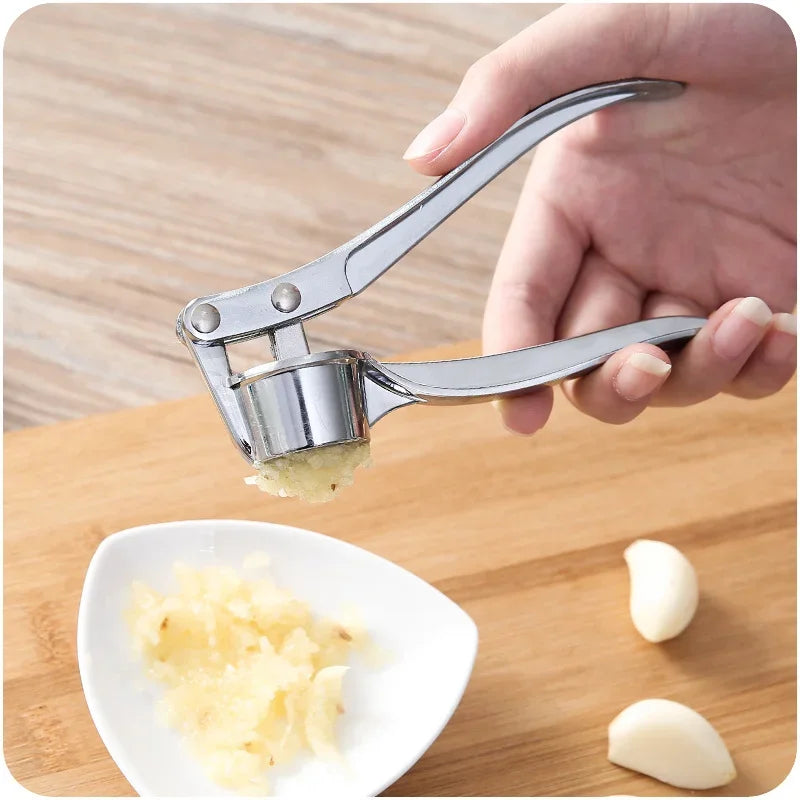 Stainless steel garlic press crusher and mincer for easy garlic grinding and manual squeezer use