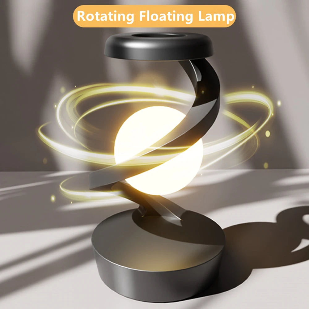 A modern creative table lamp with a rotating floating design, built-in 15W wireless charger for mobile phones, and RGB atmosphere night light for a cozy ambiance.