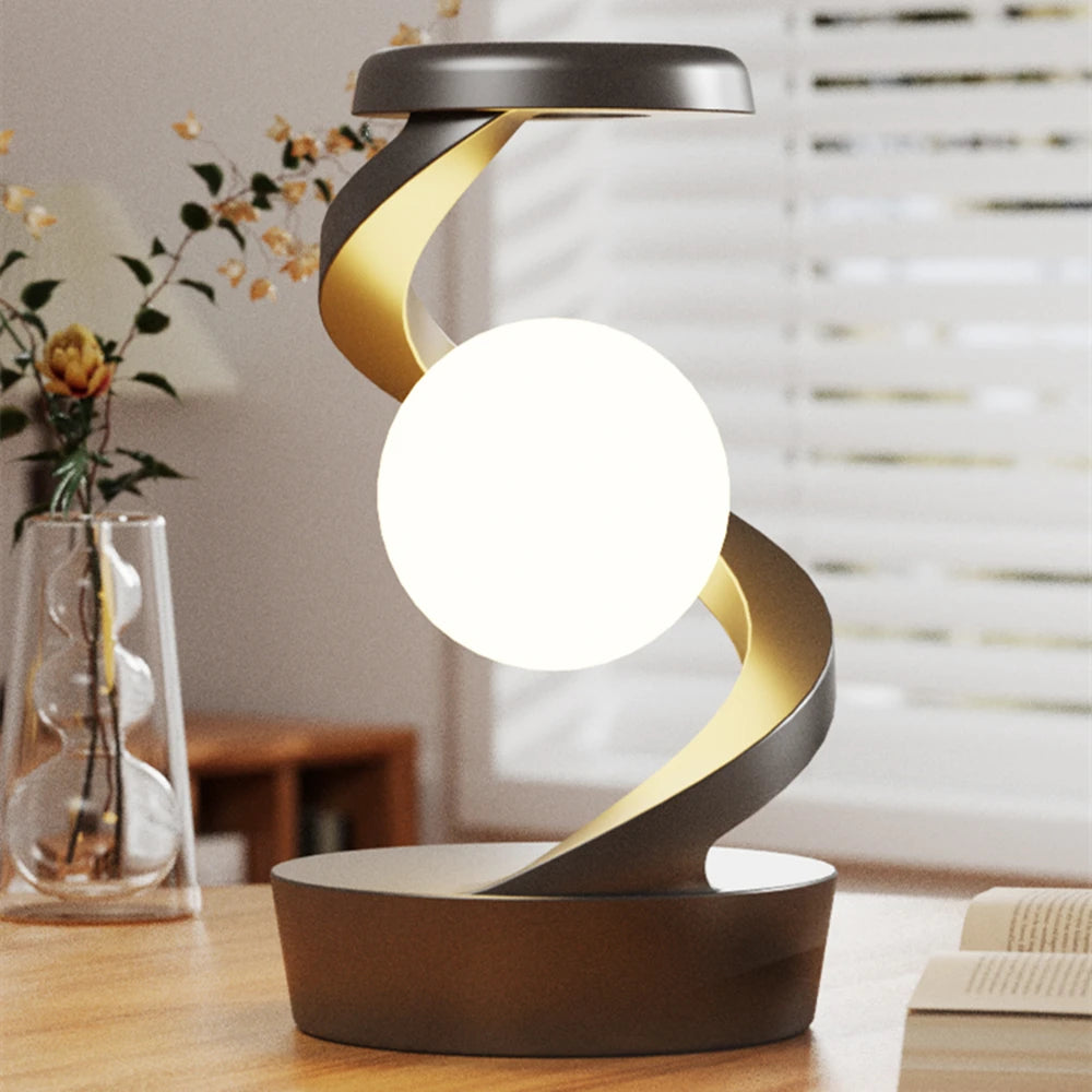 A modern creative table lamp with a rotating floating design, built-in 15W wireless charger for mobile phones, and RGB atmosphere night light for a cozy ambiance.