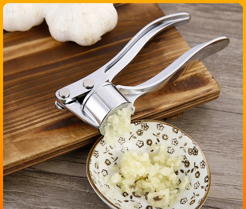 Stainless steel garlic press crusher and mincer for easy garlic grinding and manual squeezer use