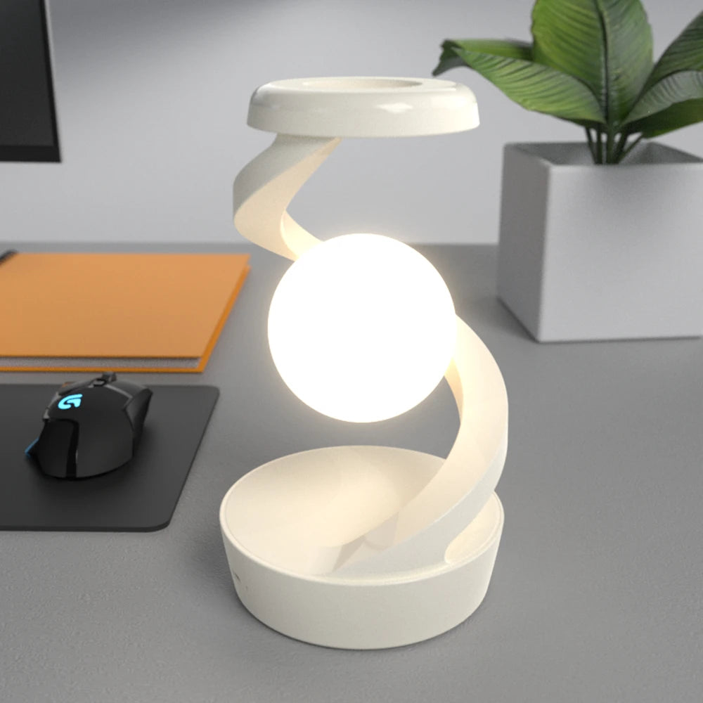 A modern creative table lamp with a rotating floating design, built-in 15W wireless charger for mobile phones, and RGB atmosphere night light for a cozy ambiance.